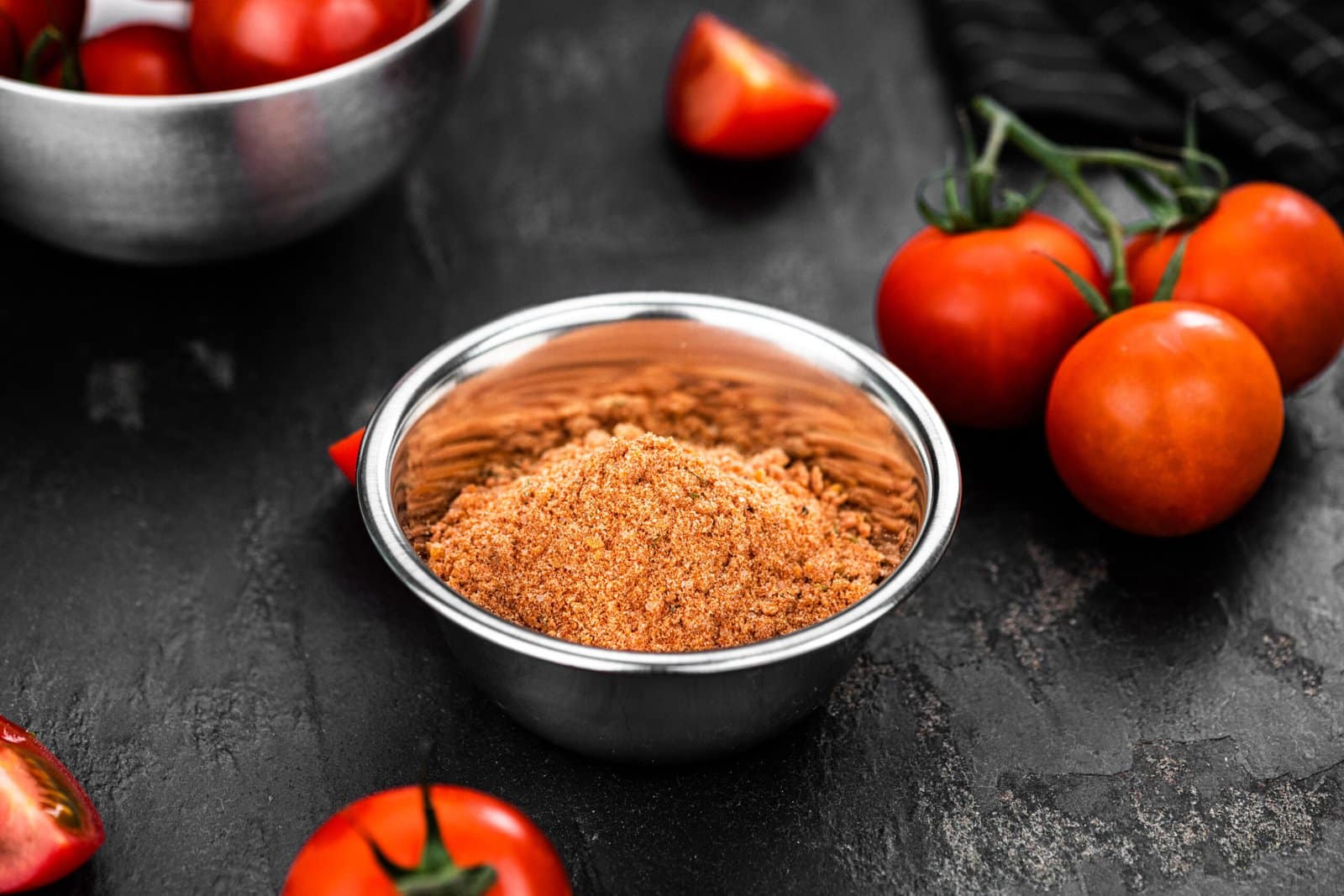 Portion of Tomato Powder (close up; selective focus)